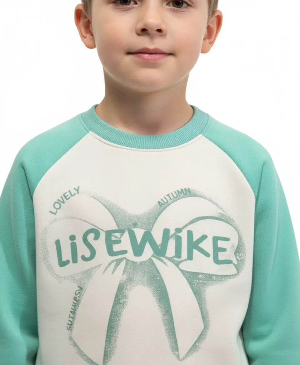 Child wearing a teal and white shirt with 'Lise Wike' text and design.