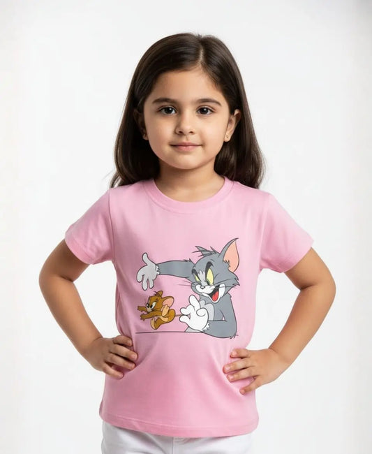 Young girl wearing a pink t-shirt with cartoon characters on a white background