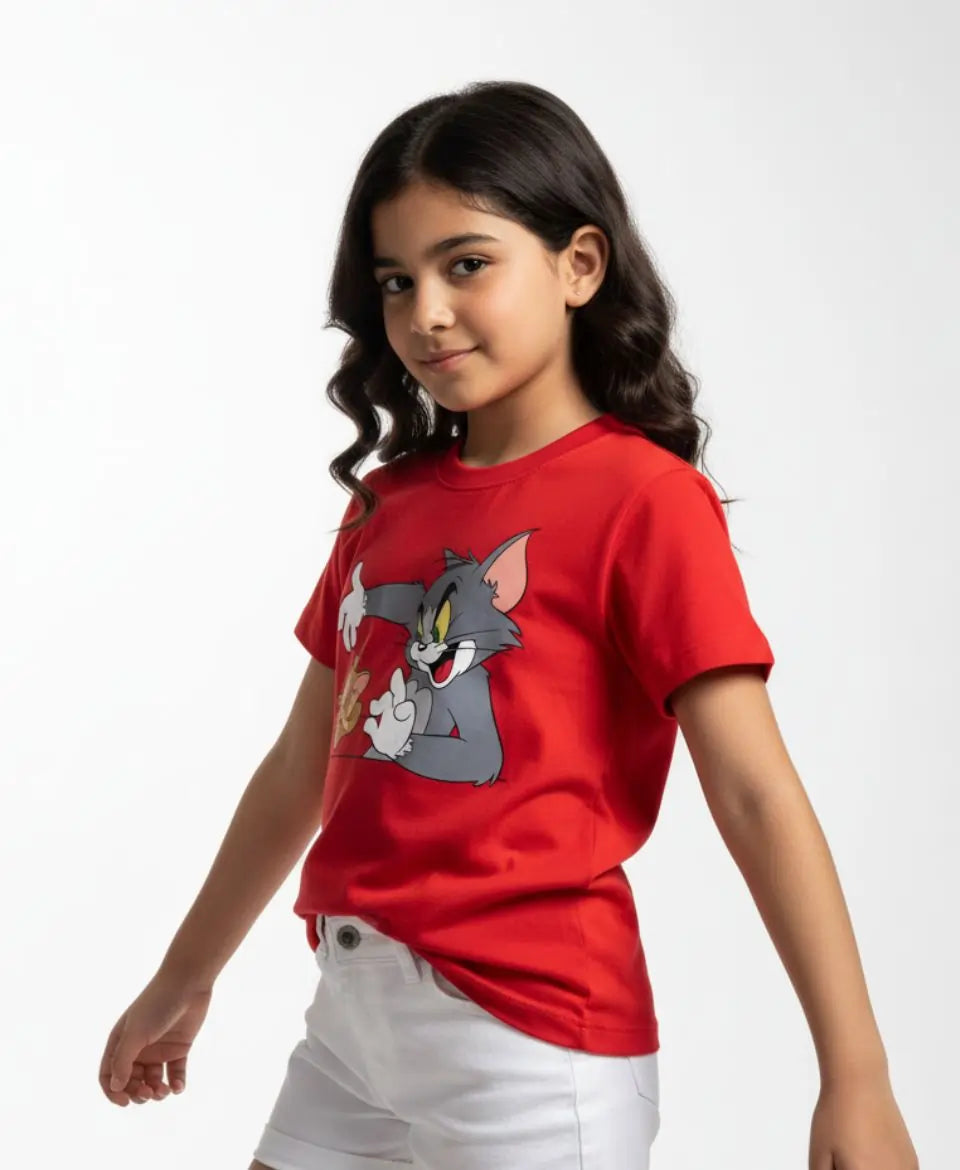 Child wearing a red t-shirt with a cartoon character on a white background