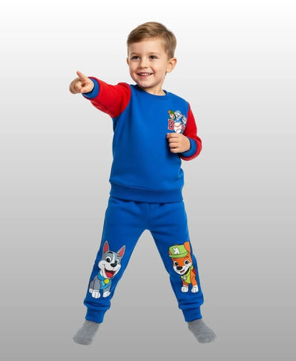 Child wearing a blue and red outfit with cartoon characters on a light gray background