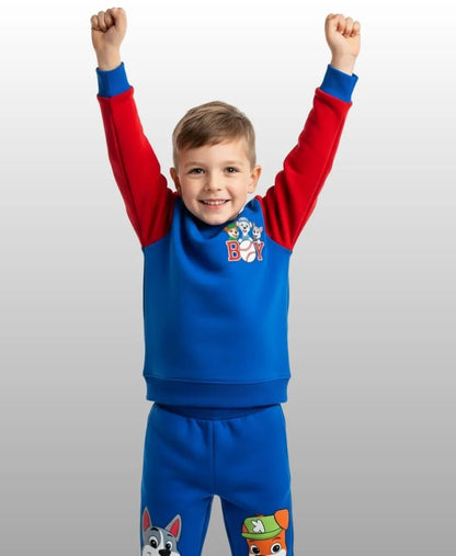 Child wearing a blue and red outfit with cartoon characters on a white background