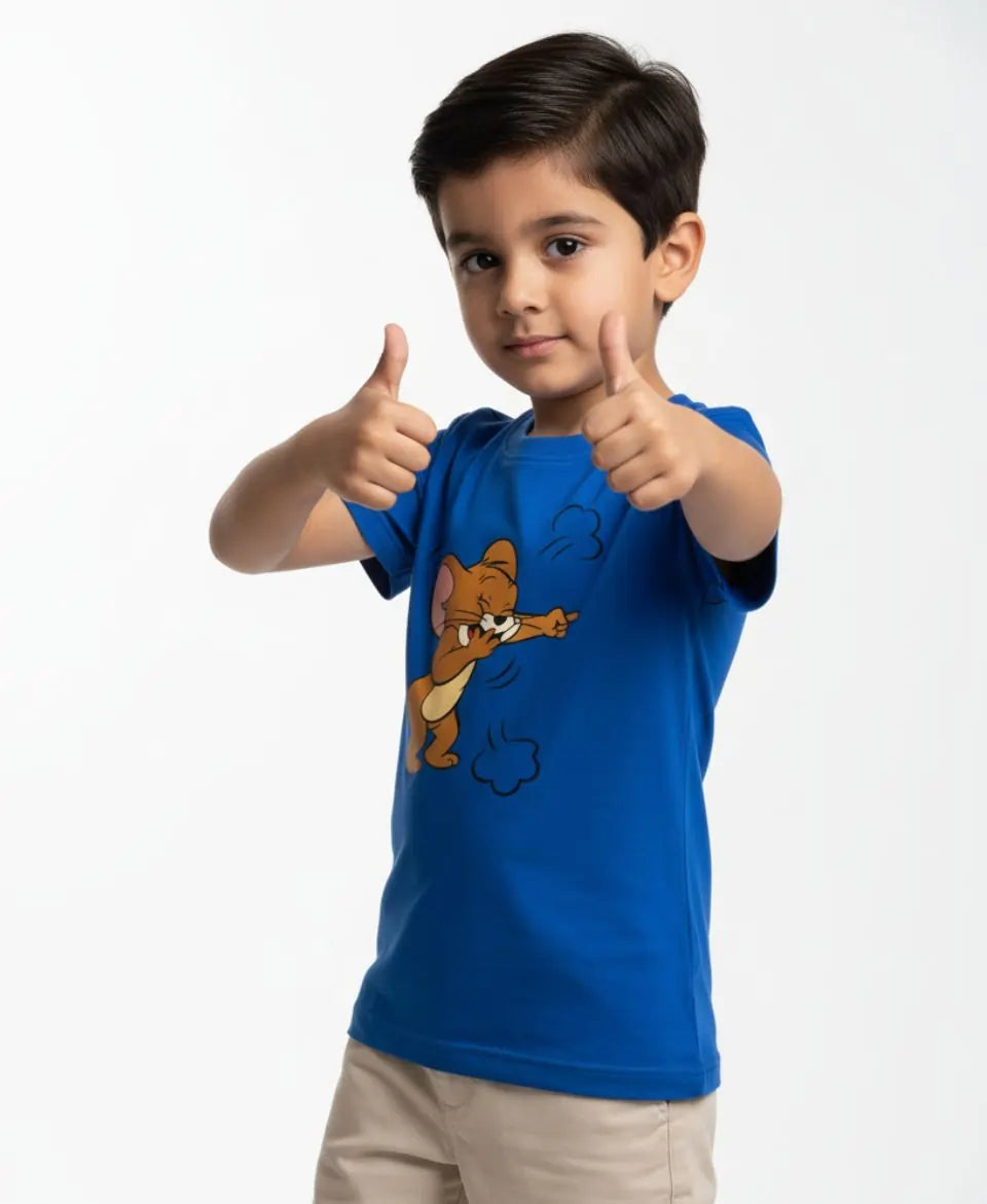 Child wearing a blue t-shirt with a cartoon character, giving a thumbs-up gesture on a white background