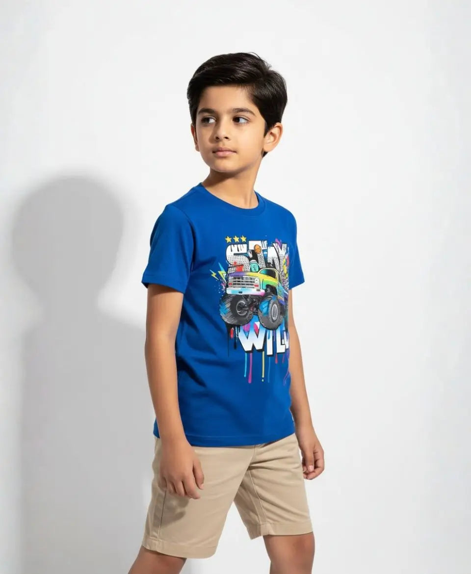 Child wearing a blue t-shirt with a graphic design on a white background