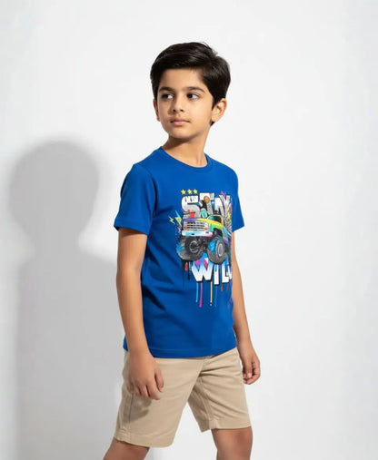 Child wearing a blue t-shirt with a graphic design on a white background