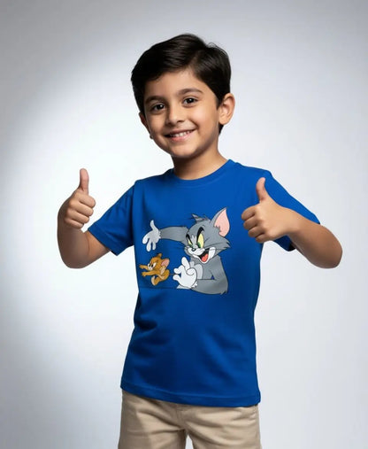 Child wearing a blue t-shirt with cartoon characters, giving a thumbs-up gesture on a plain background