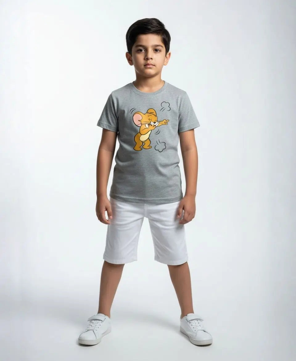 Child wearing a gray t-shirt with a cartoon character and white shorts on a white background
