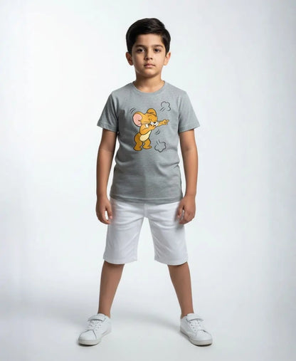 Child wearing a gray t-shirt with a cartoon character and white shorts on a white background