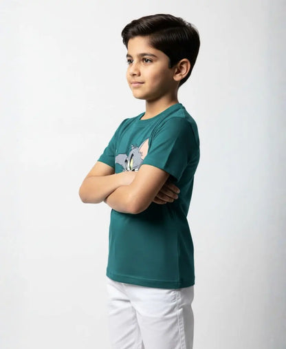 Child wearing a green t-shirt with a graphic design on a white background