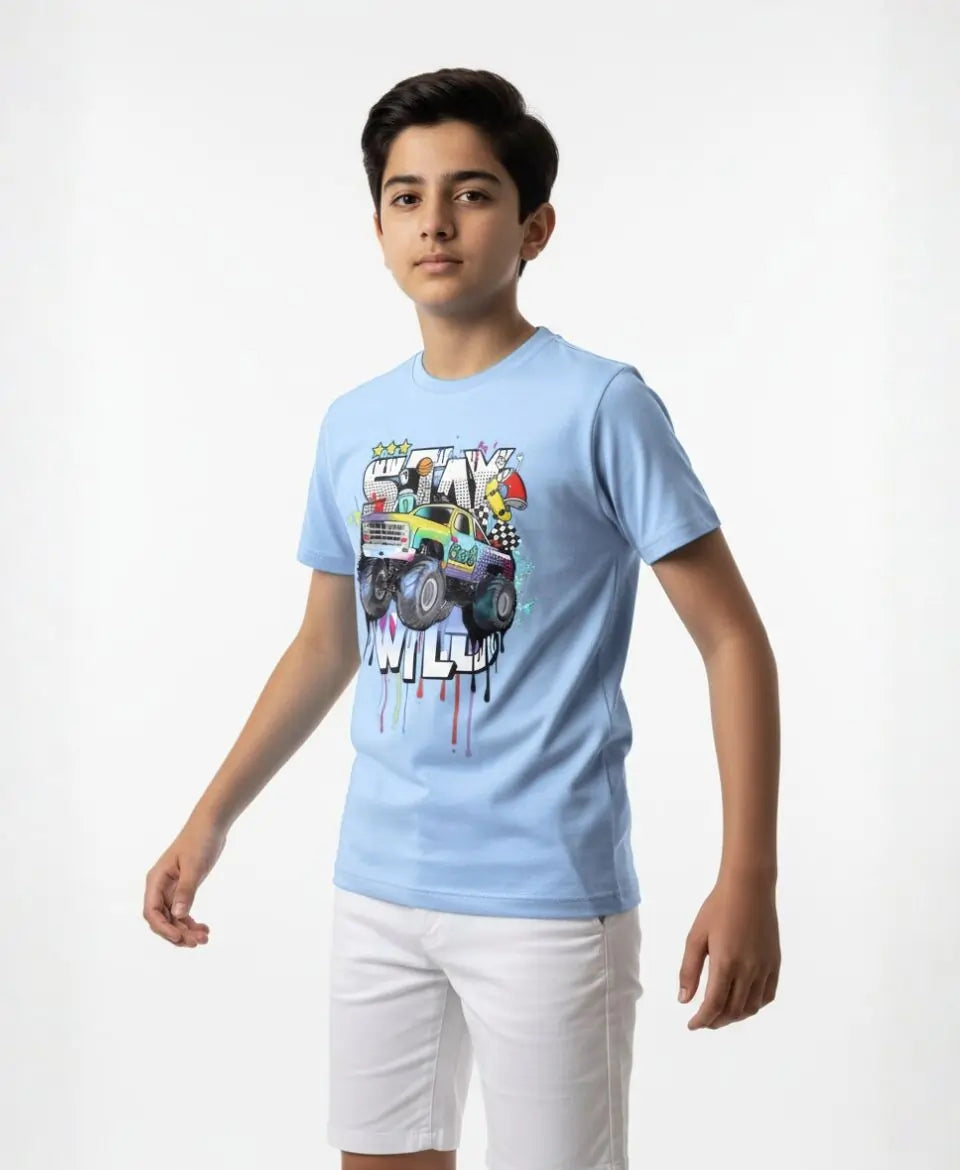 Child wearing a light blue t-shirt with a colorful graphic design on a white background
