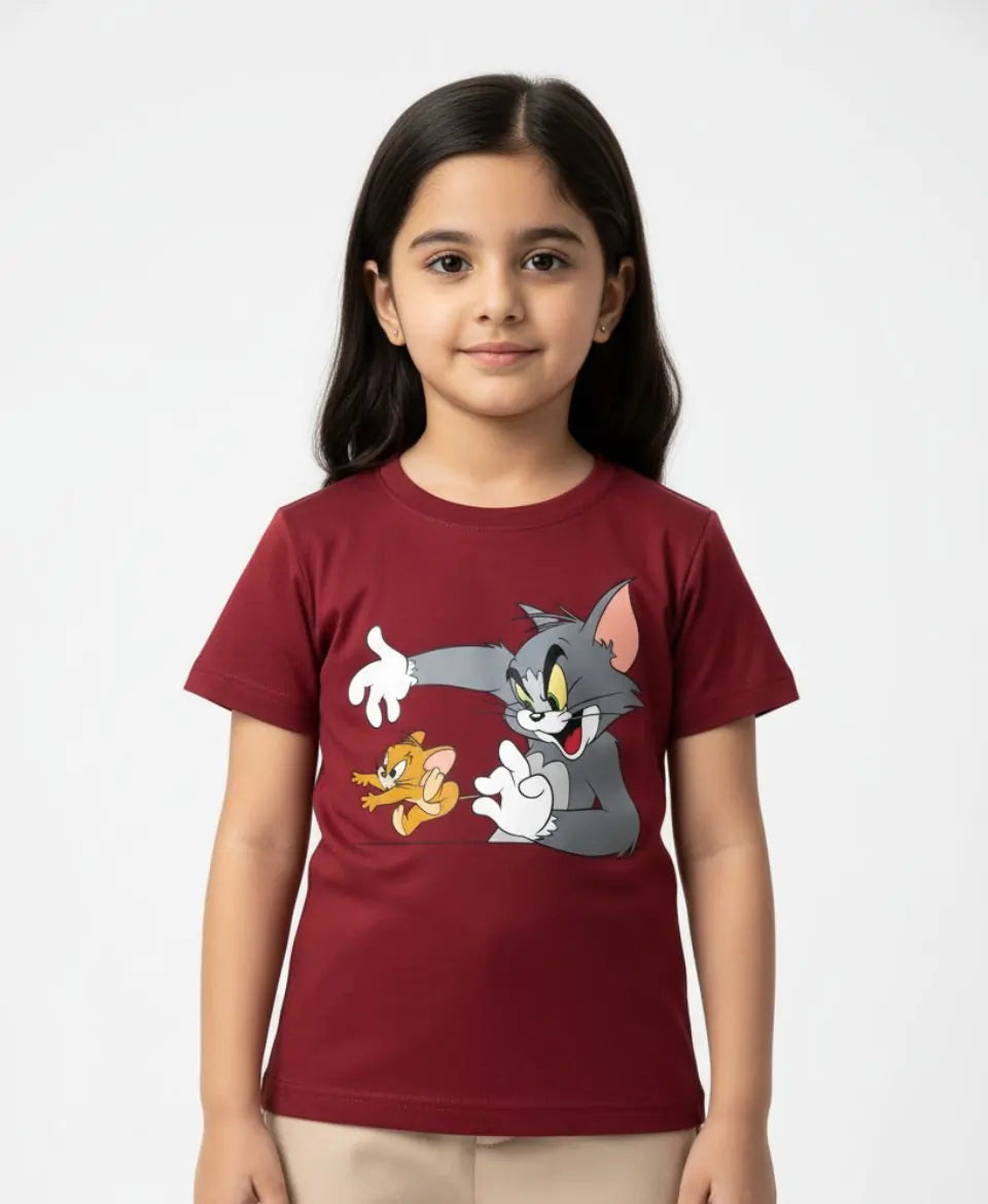 Child wearing a red t-shirt with cartoon characters on a white background
