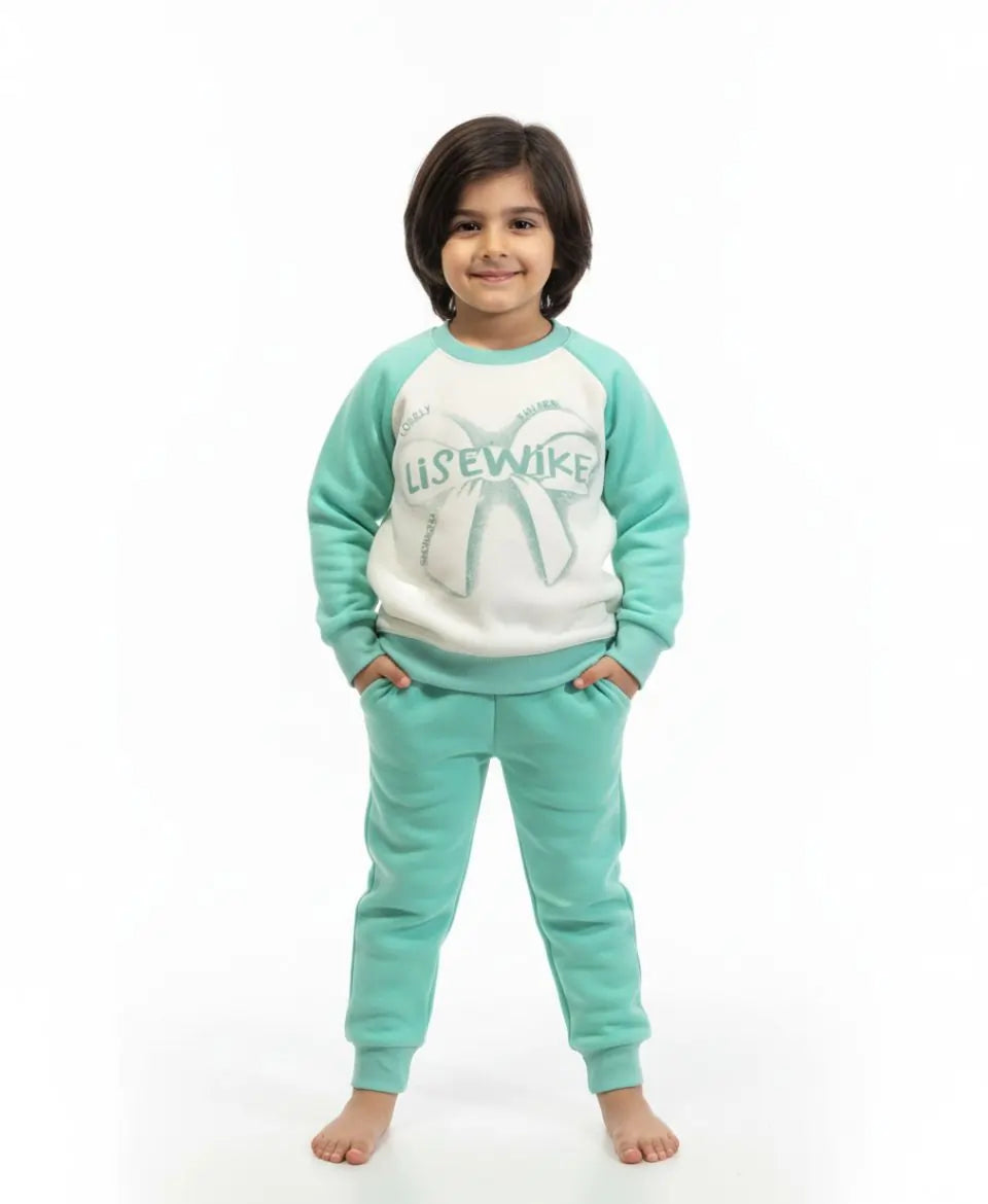 Child wearing a teal and white pajama set with a visible brand logo on a white background