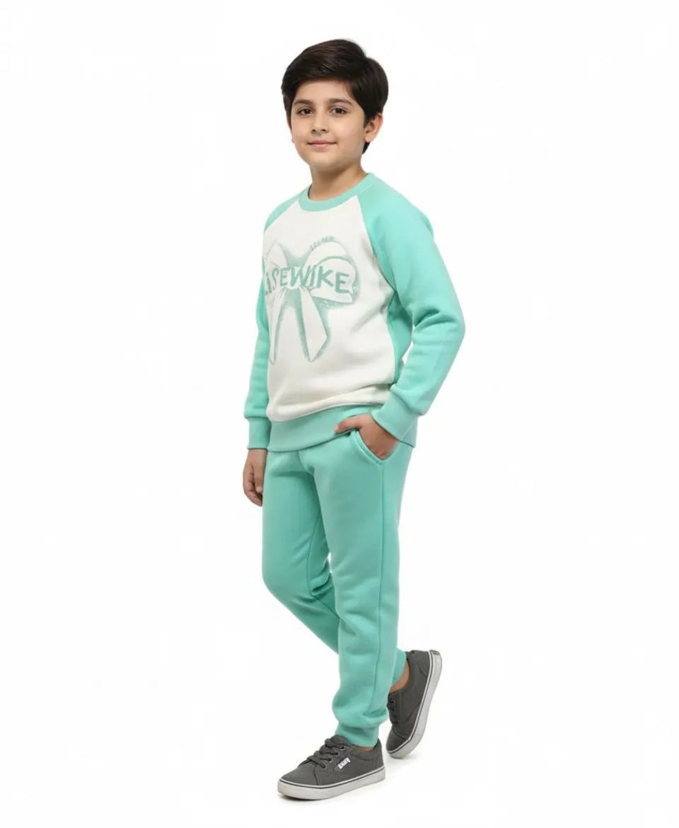 Child wearing a teal and white tracksuit with a logo on a white background