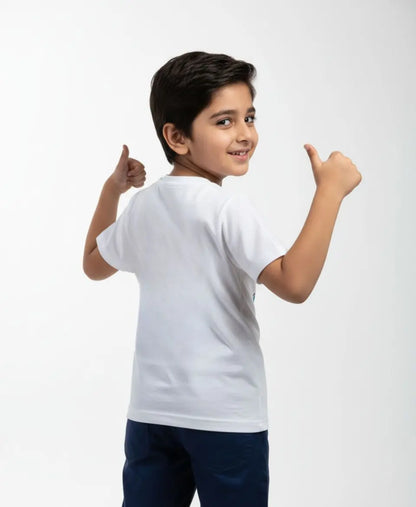 Child wearing a white t-shirt and dark shorts on a light gray background