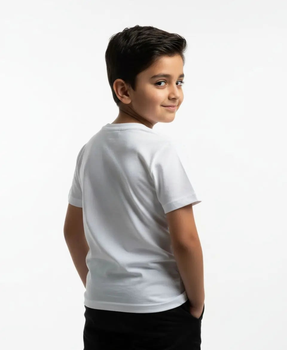 Child wearing a white t-shirt on a plain background