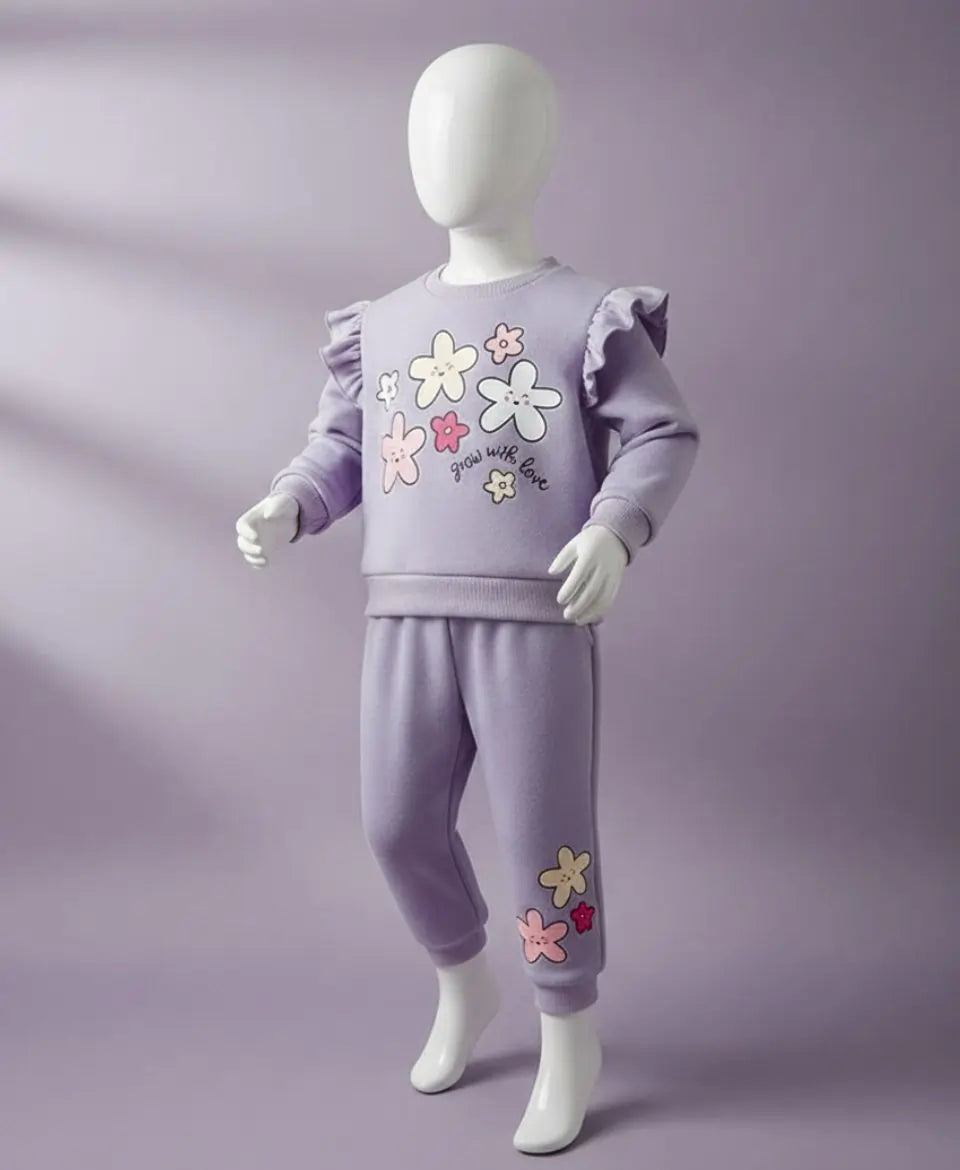 Children's lavender outfit with floral designs on a purple background