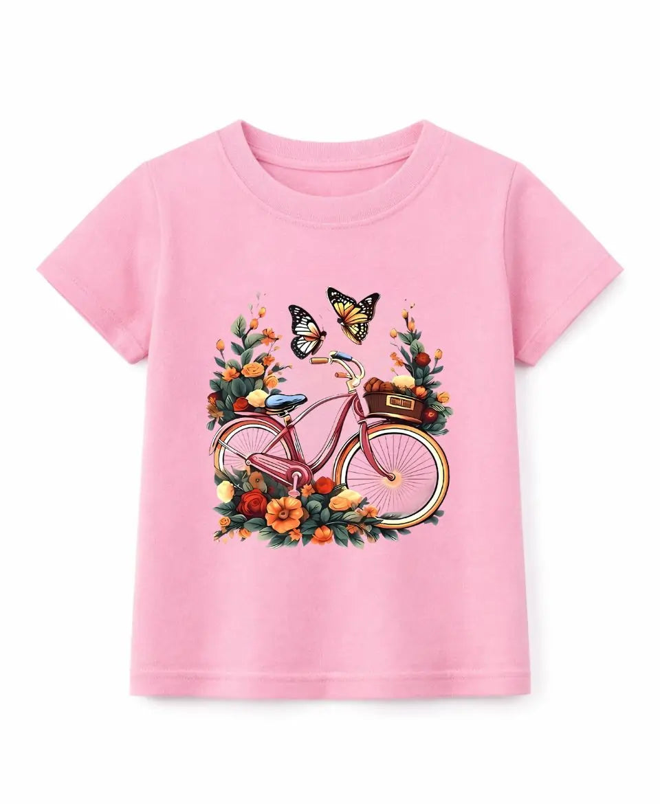 Pink t-shirt with a bicycle and butterfly graphic on a white background