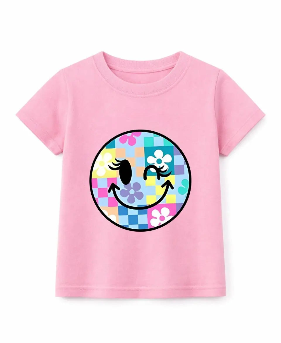 Pink t-shirt with a colorful smiley face design on a white background