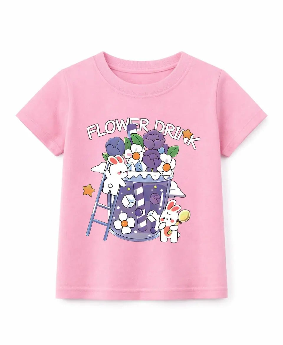 Pink t-shirt with cartoon design of a cup, flowers, and bunnies on a white background