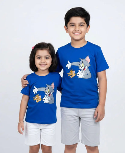 Two children wearing blue shirts with cartoon characters on a white background