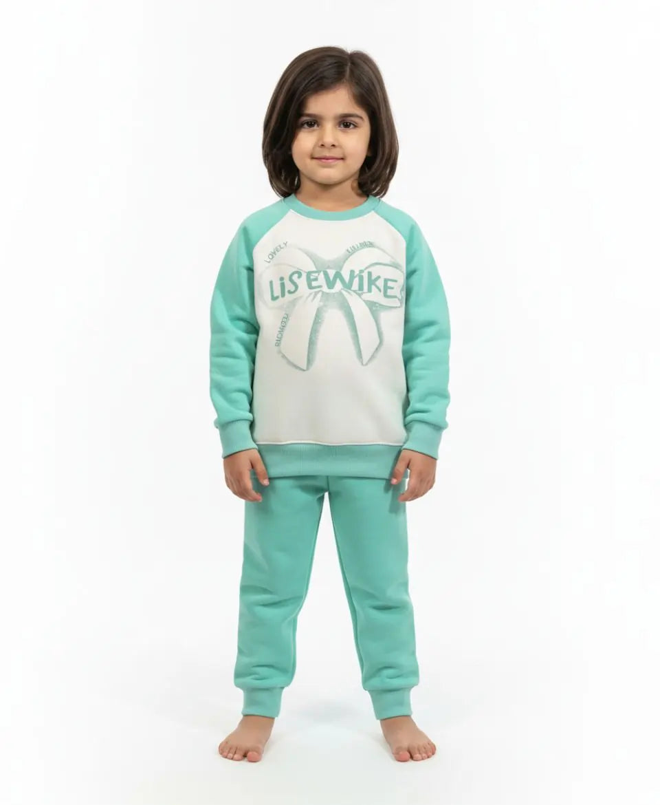 Child wearing a teal and white pajama set with a visible brand logo on a white background